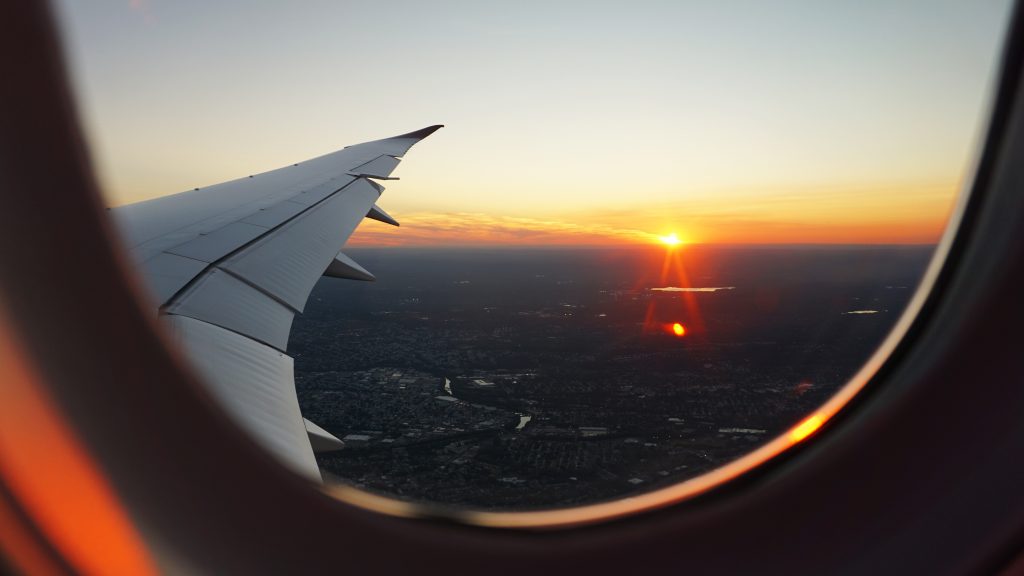View from Airplane Window Seat during Sunset