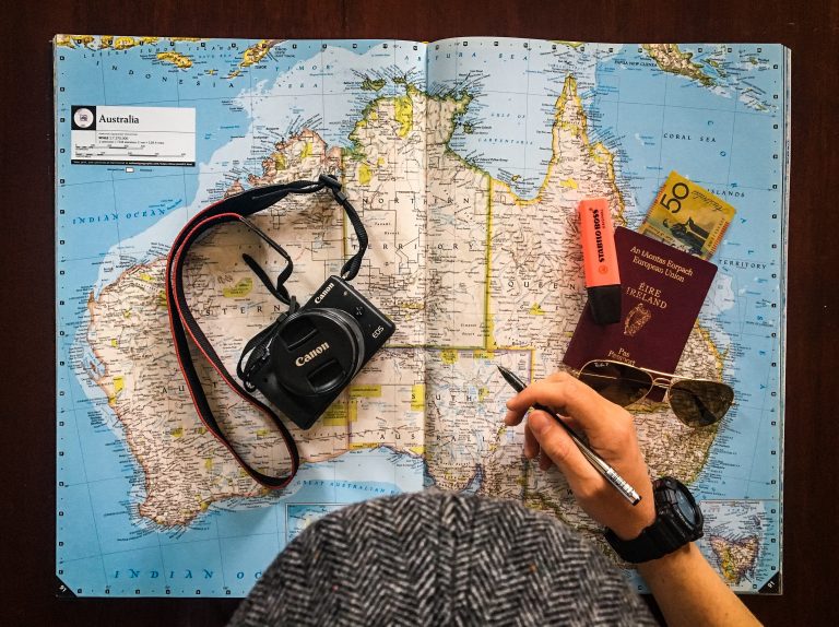 World Map Camera and Passport Before Traveling to a New Place